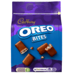Cadbury Oreo Bites Chocolate Bag 100g with crunchy Oreo pieces coated in smooth Cadbury milk chocolate – available at Mart Subhani Dundee